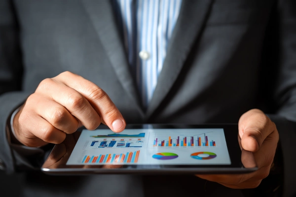 Person using tablet to check services of innovate iq technologies